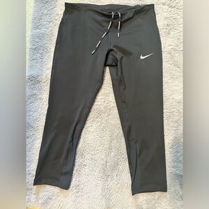 Nike new with tags women’s dri fit tight fit running pants.
